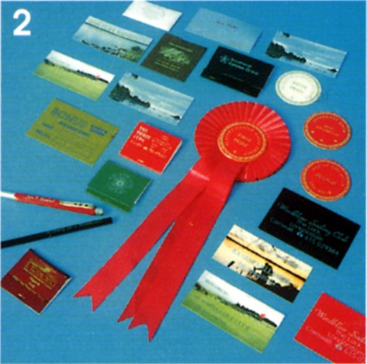 Business cards, rosettes, membership cards, named pencils, calendars.